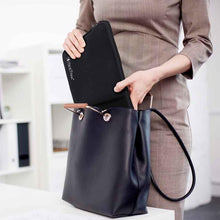 14x10 | sidetrack | protective case with sleeve | portable monitor case | woman putting portable monitor case with pocket inside tote bag