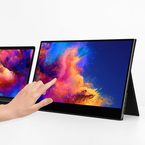 15.6 | 4K | Touch | Solo | Side Trac | Touch Screen Monitor | a dual screen set up with a Solo Touch 4K 15.6 monitor attached via cord to the right side of a laptop sitting on a table with a hand touching the right screen