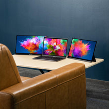 15.6 | Touch | HD | Solo Pro | Sidetrak | triple monitor for laptop | triple screen set up using solo touch  screens on a coffee table in a living room