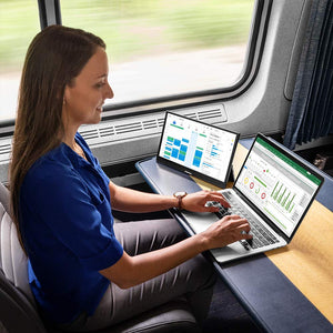 13.3 | Solo Pro Micro  | SideTrak | Touchscreen portable monitor for laptop 13 inch | Woman working on a SideTrak 13 inch portable touchscreen monitor in an Amtrax train
